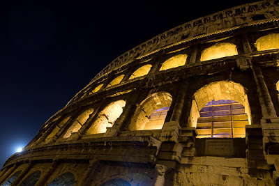 Colosseum detail at night with moon